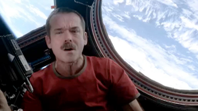 International Space Station Commander, Chris Hadfield, performs a revised version of David Bowies Space Oddity.