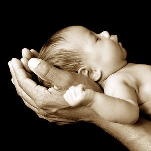 Secure, like a newborn in his dad's arms Secure, like a newborn in his dad's arms