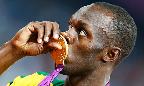 Usain Bolt kisses his gold medal during the presentation ceremony for the men's 200m final Usain Bolt kisses his gold medal during the presentation ceremony for the men's 200m final